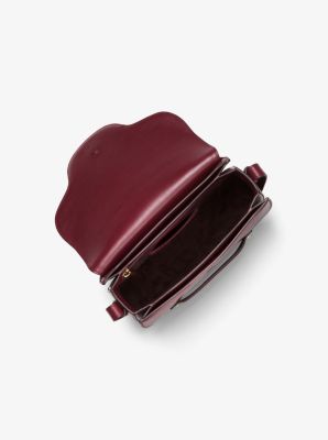 Cary Medium Grommeted Leather Saddle Bag