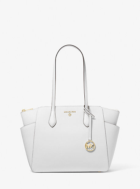 Mk Tote selling white and black